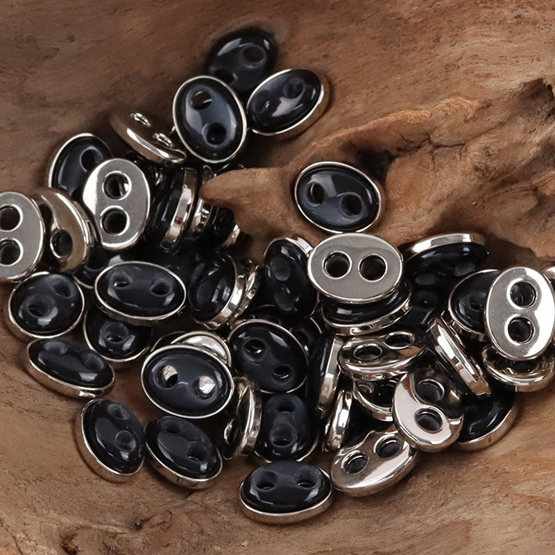 Pig nose resin buttons: black faces with silver-tone metal rims, oval 2-hole design