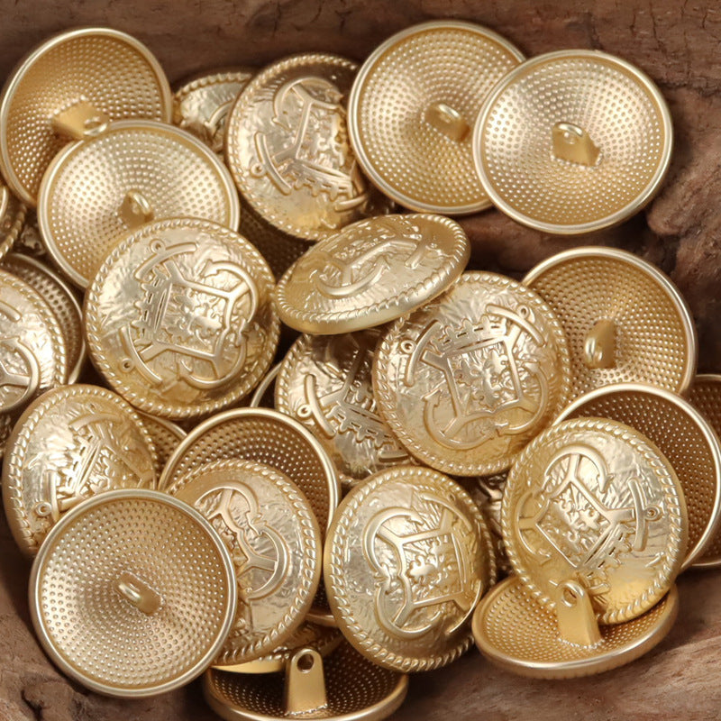 Gold-tone anchor hook metal buttons, round face with crest motif and loop shank