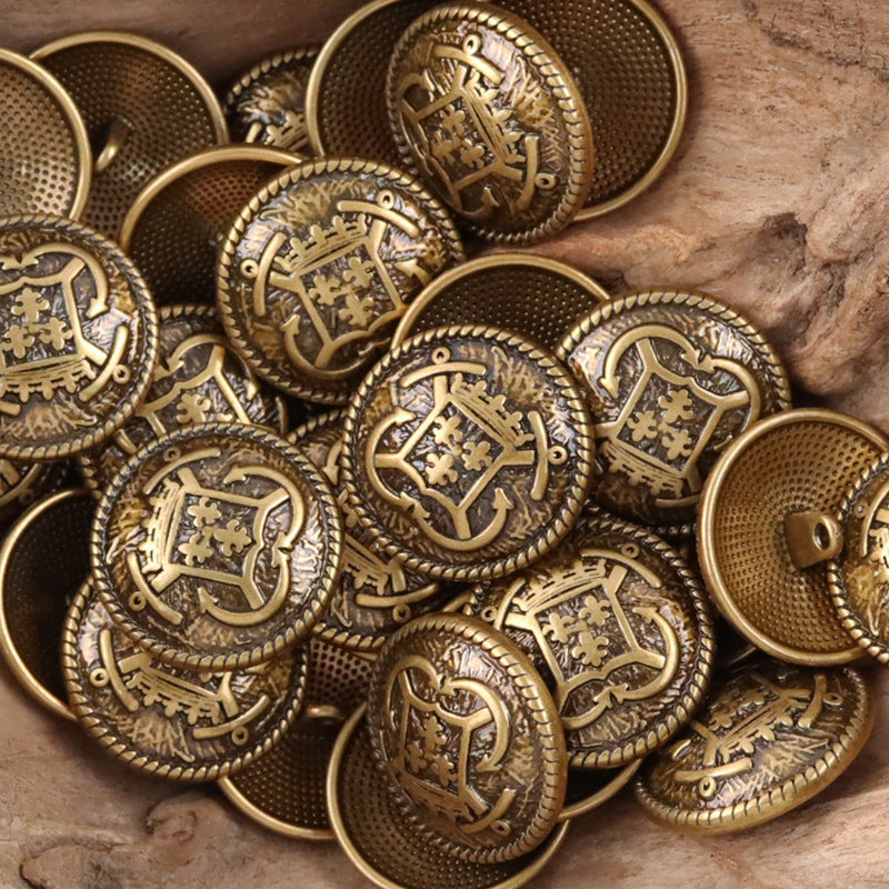 Bronze/gold anchor hook metal buttons with crest designs and perforated backing backs