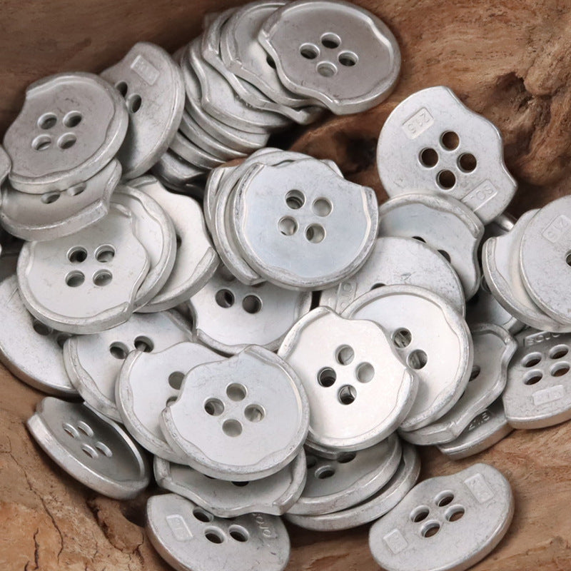 Matte silver irregular metal buttons, round-edged shape, 4-hole front