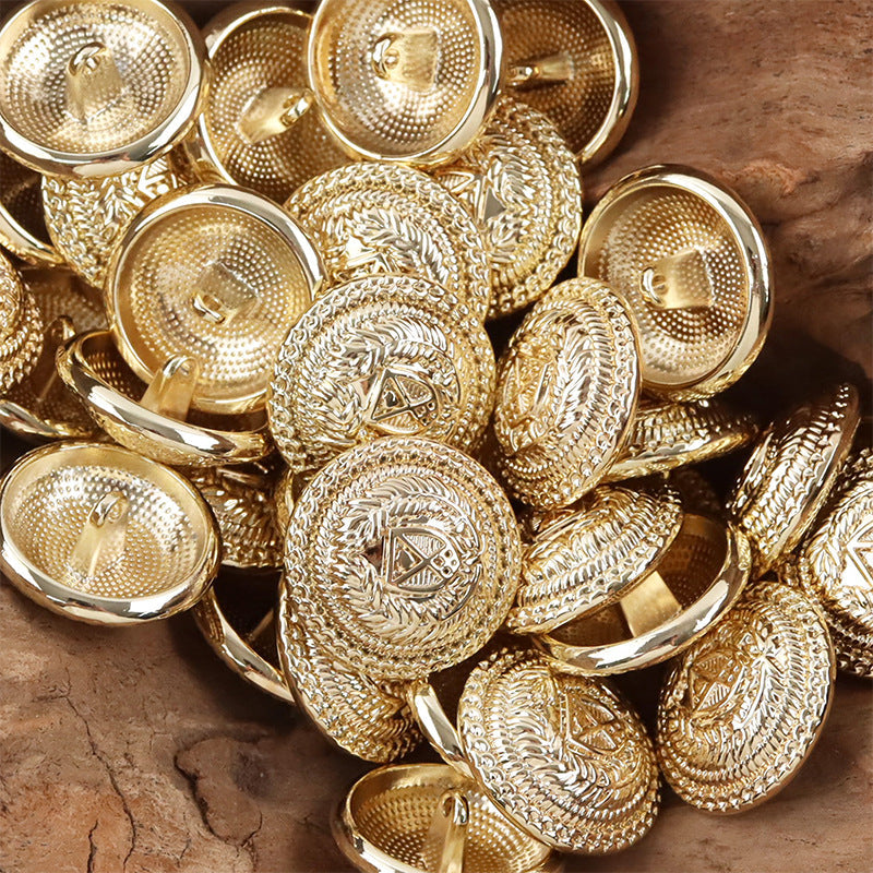 Gold metal shank buttons set with crest emblem and ornate laurel edging