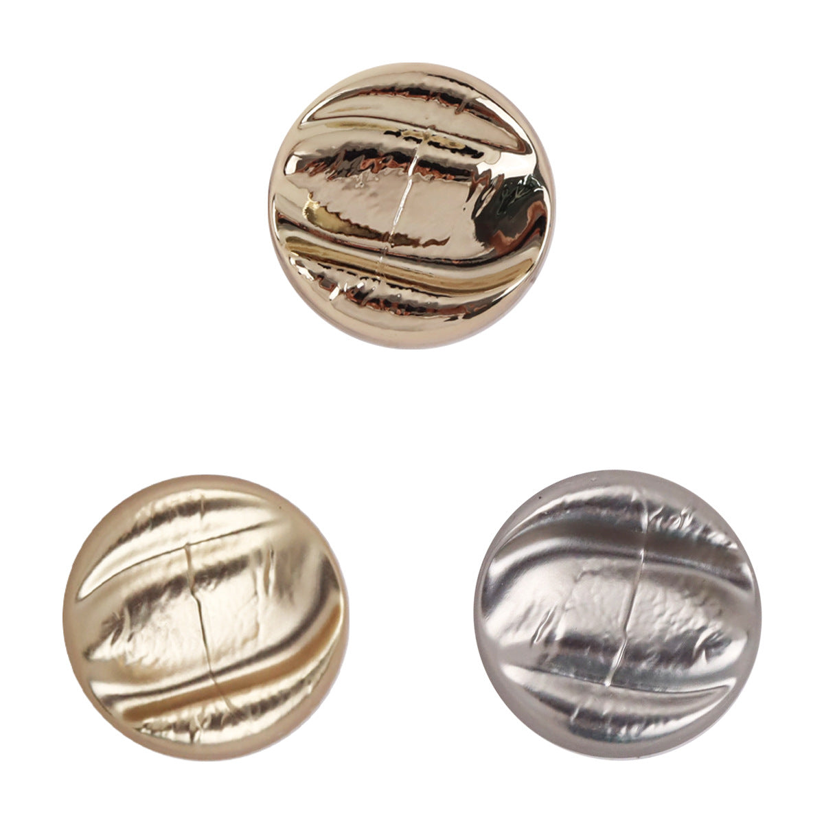 Irregular metal shank buttons in rose gold and silver, oval front