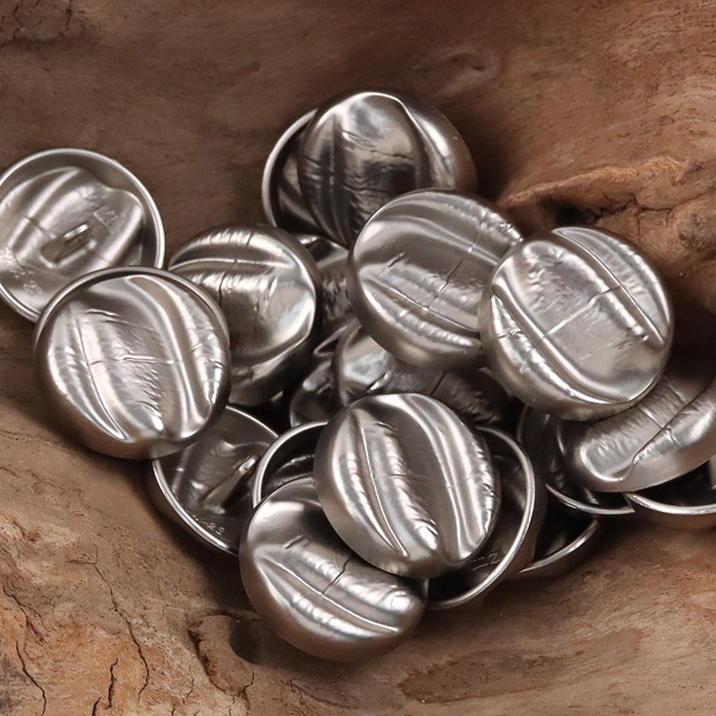 Silver irregular oval metal shank buttons, oval fronts with textured shine