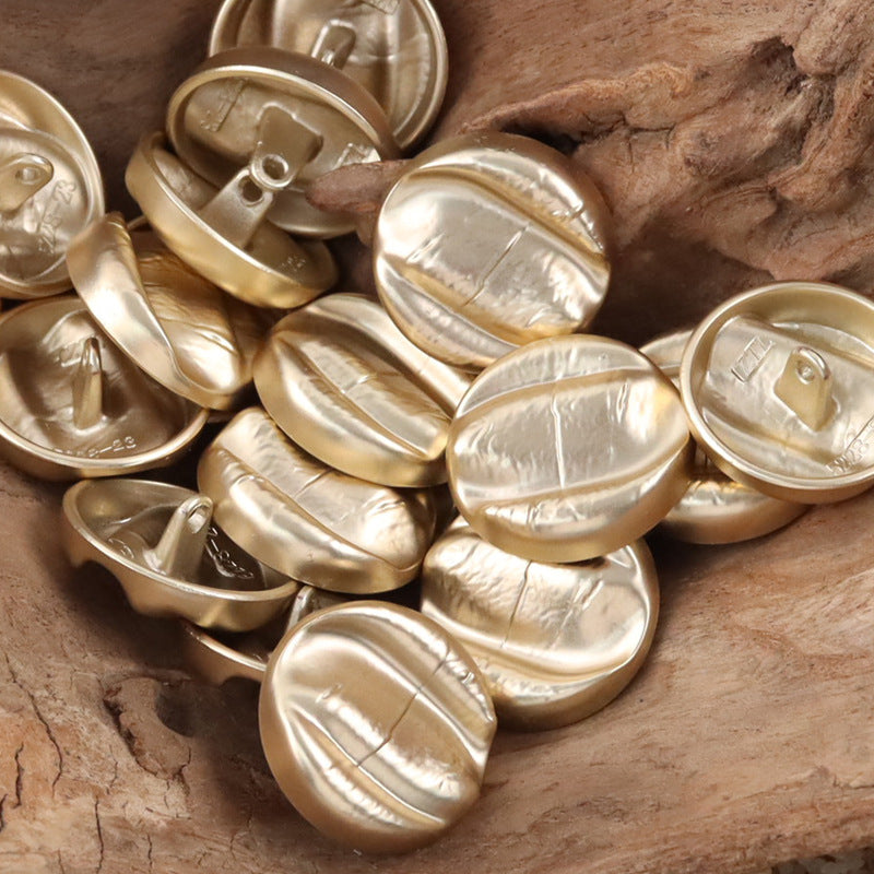 Gold irregular oval metal shank buttons, backs with loop shanks
