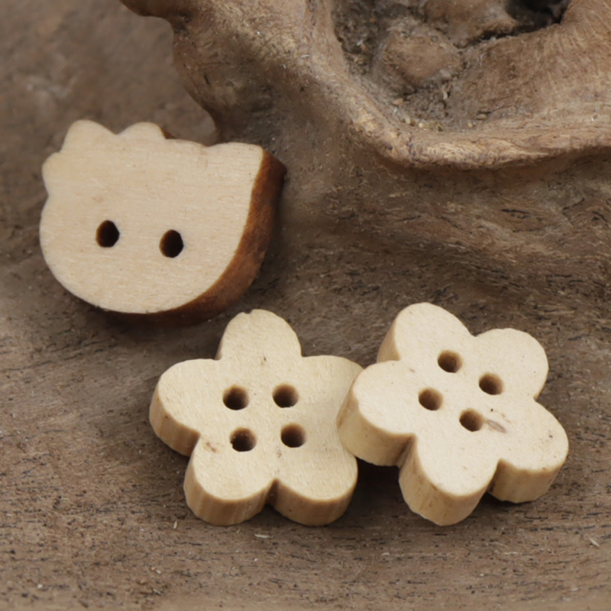 Wood buttons: three Flower (11.5mm) designs, light tan, each with five holes
