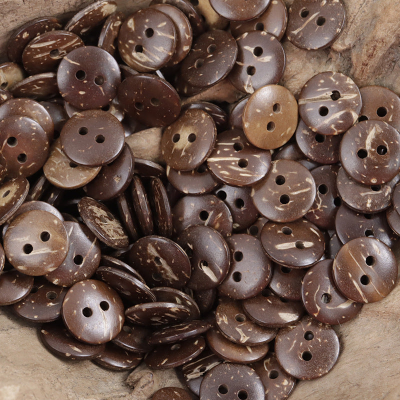 Dark brown round coconut shell buttons, speckled finish, visible 4-hole fronts (pile).