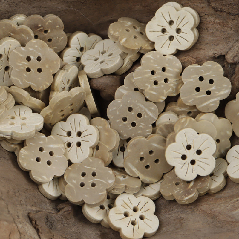 Beige small flower buttons with etched lines and multiple sewing holes