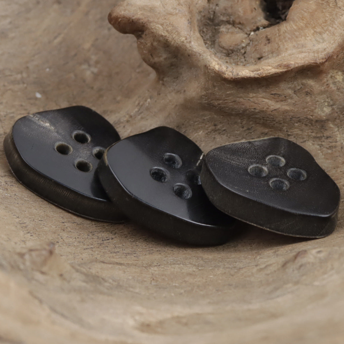 Set of vintage natural horn buttons, dark tones, irregular shapes with 4 holes each.