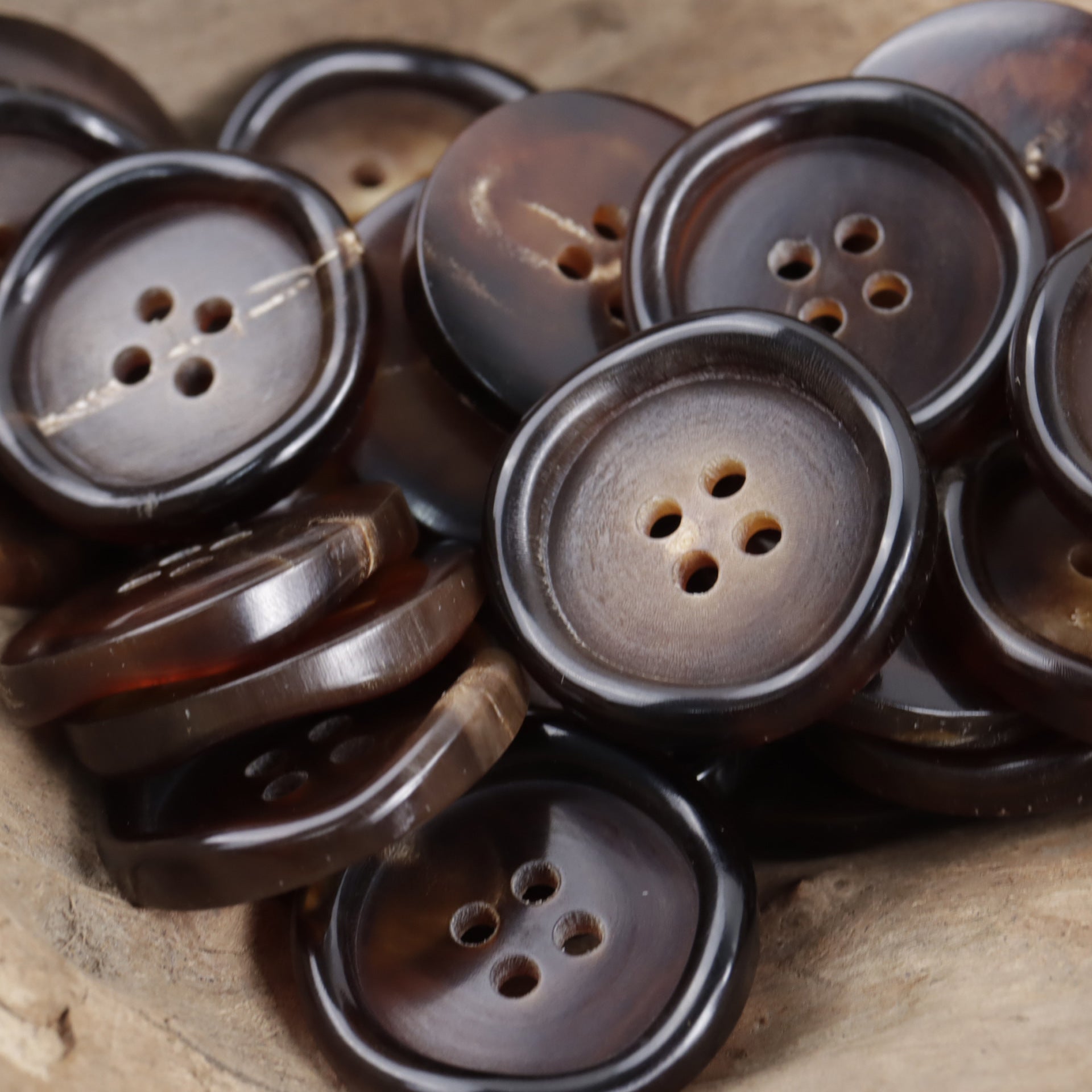 10pcs 4-hole horn buttons, dark brown/gray mix, curved wave edge detail