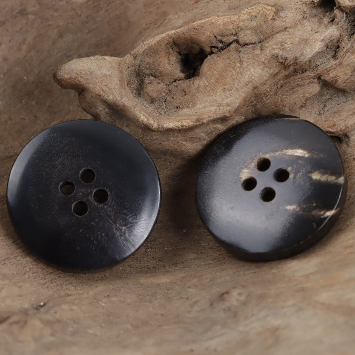 Black real horn buttons with 5-hole design, glossy round face