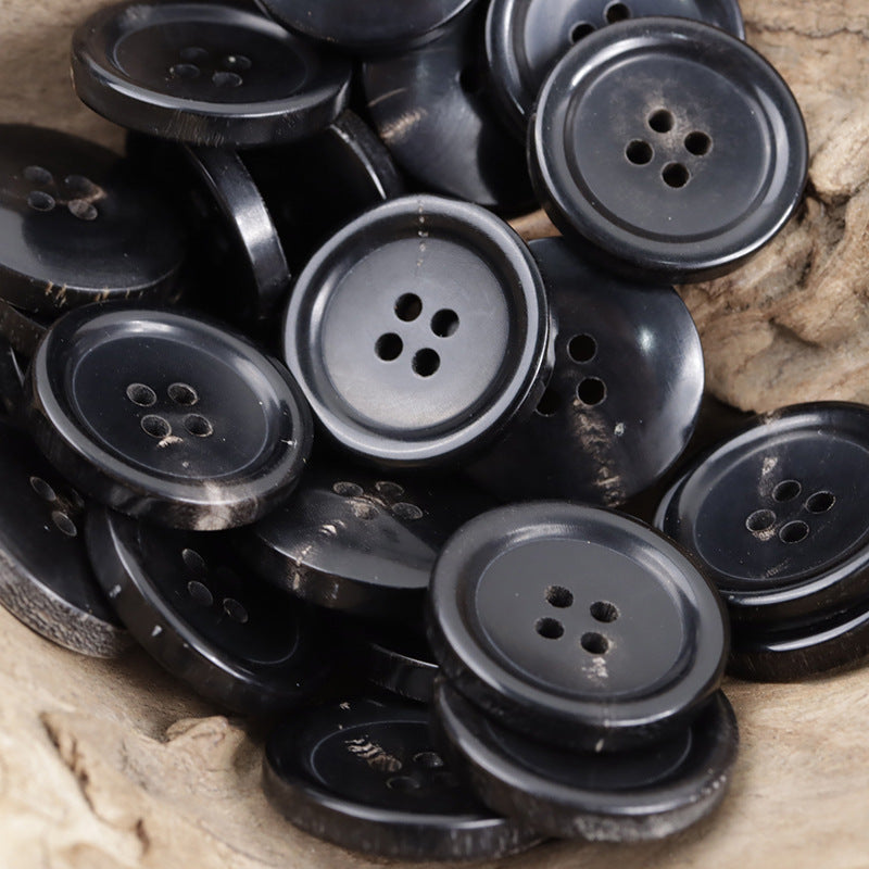 Assorted black horn suit buttons, multiple 4- and 5-hole views