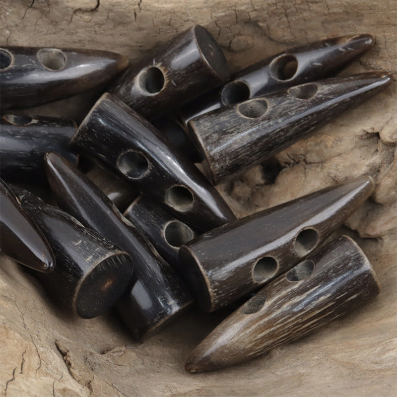 Set of horn-style toggle buttons in dark brown, two-hole openings, multiple pieces