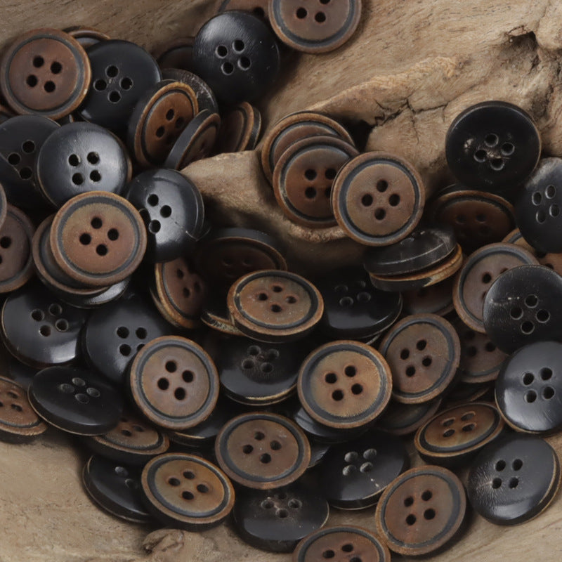 Vintage charred horn buttons pile, 4-hole design in black and brown tones (10 pcs)