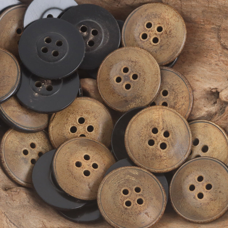 Set of 22mm four-hole ox horn buttons in burnt tan and dark tones, round discs
