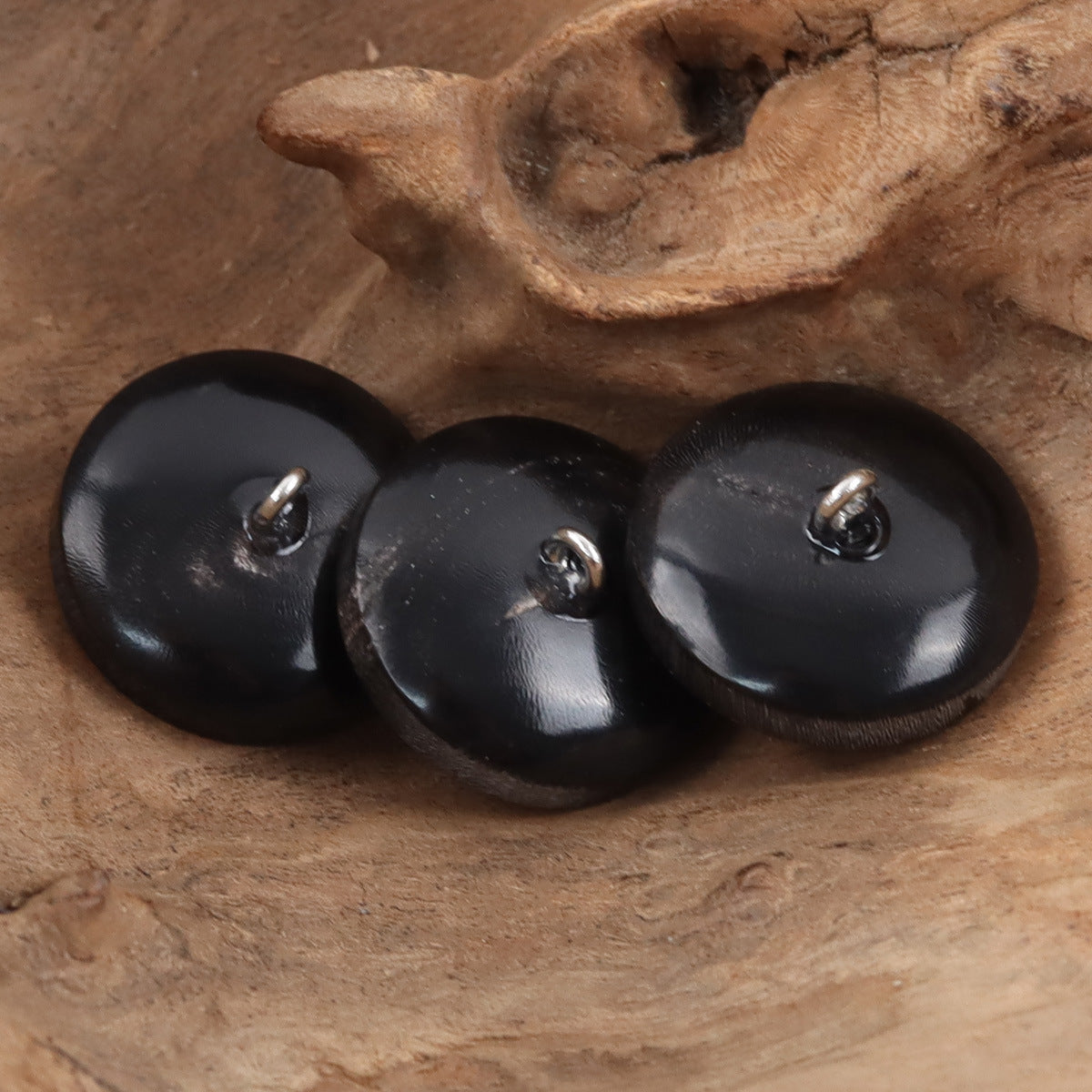 Dark horn shank buttons for sweaters, round design with silver-colored shanks