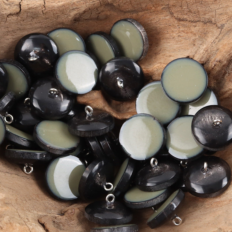 Mixed set of horn shank buttons with metal loops; round gray-green and dark tones