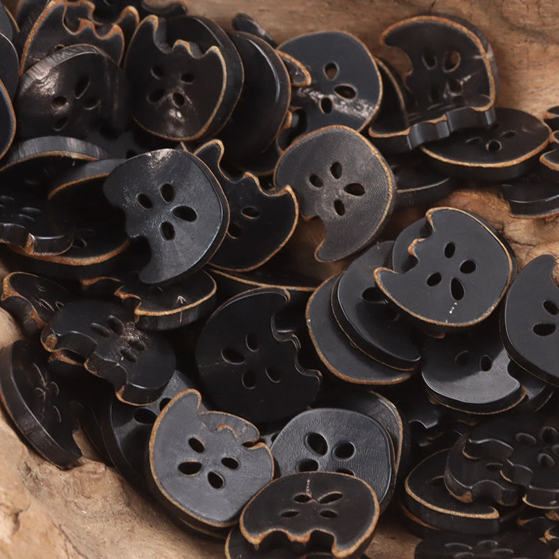 Mixed lot of dark 4-hole apple-shaped cow horn buttons, visible button holes