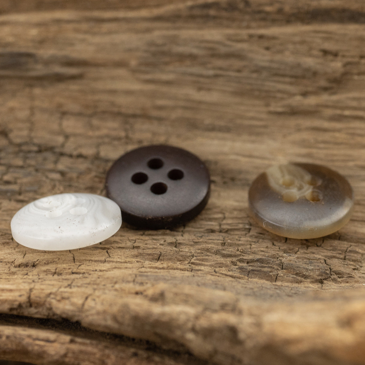 Resin shirt buttons with 4 holes: white, dark brown, and smoky translucent