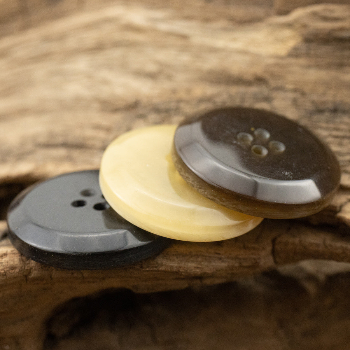 Beveled woodgrain resin buttons, dark brown/charcoal and pale yellow, 4-hole, 15-30mm