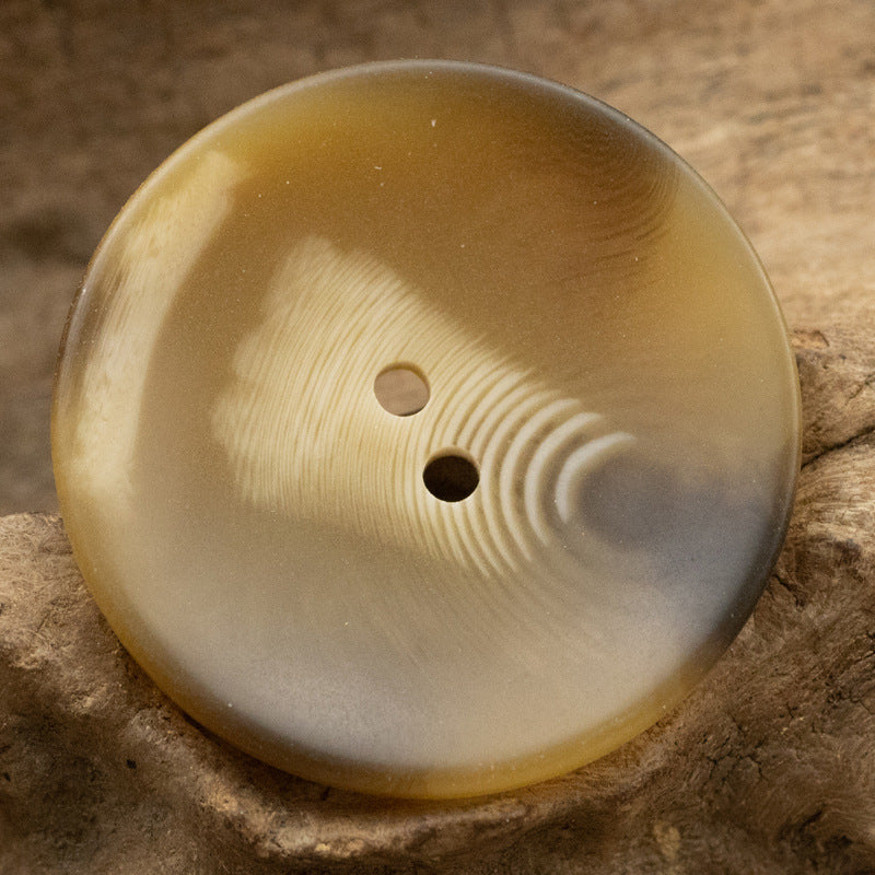 Khaki two-hole bowl-shaped resin coat button