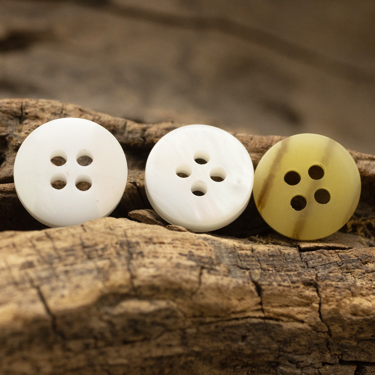 11.5mm resin buttons with 4 holes: two white and one khaki woodgrain style