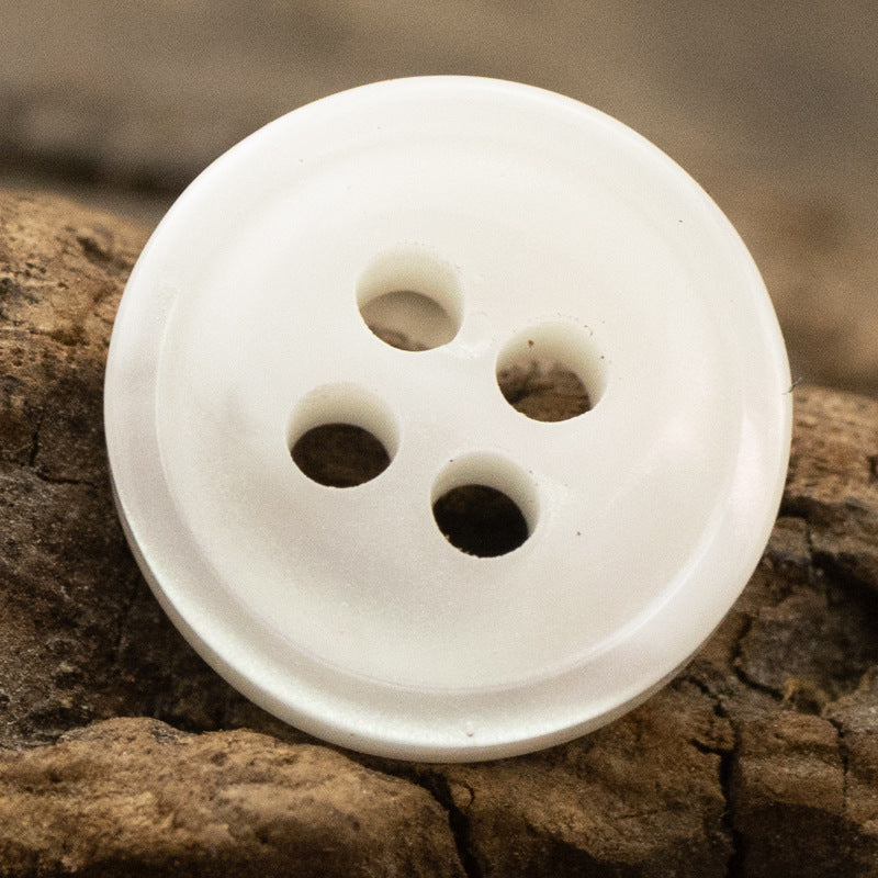 White 11.5mm resin button with 4 holes, smooth woodgrain-look finish