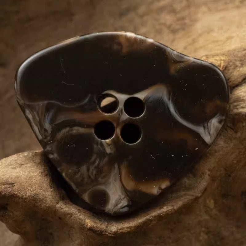 Large irregular resin button, dark coffee-brown marble-look with 4 holes.