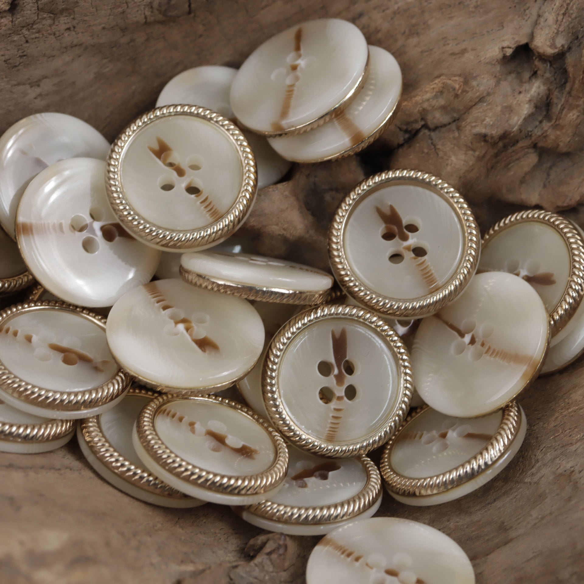 Beige four-hole flat resin buttons with metal lace border, round set