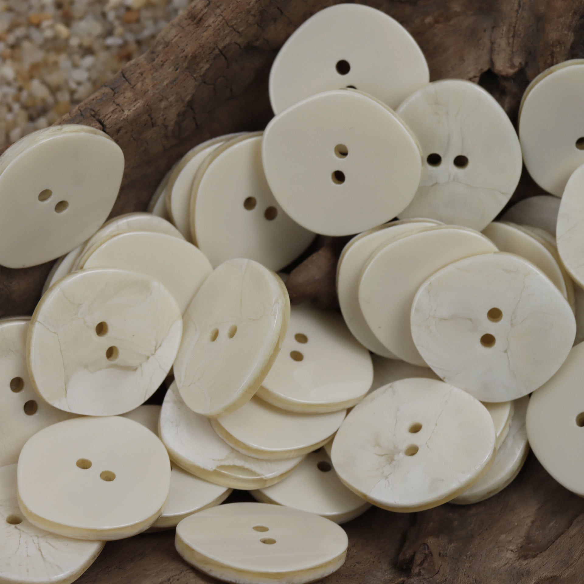 White resin buttons pile, extra-large 30mm; multiple pieces with visible holes