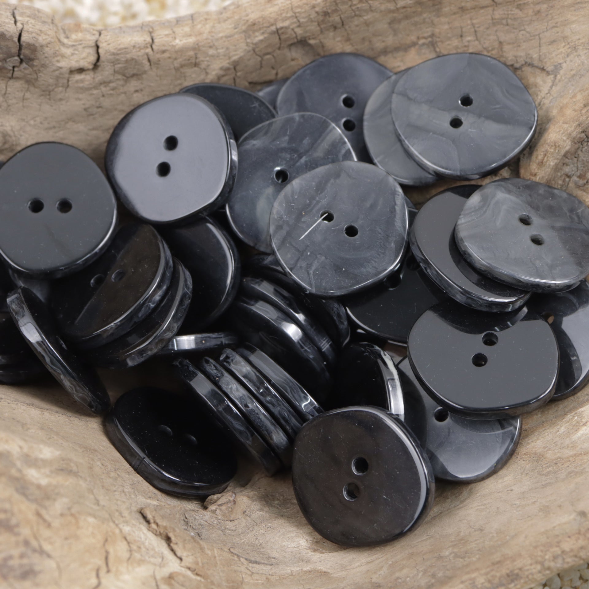 Black resin buttons, irregular rhombus; extra-large 30mm, stacked with buttonholes