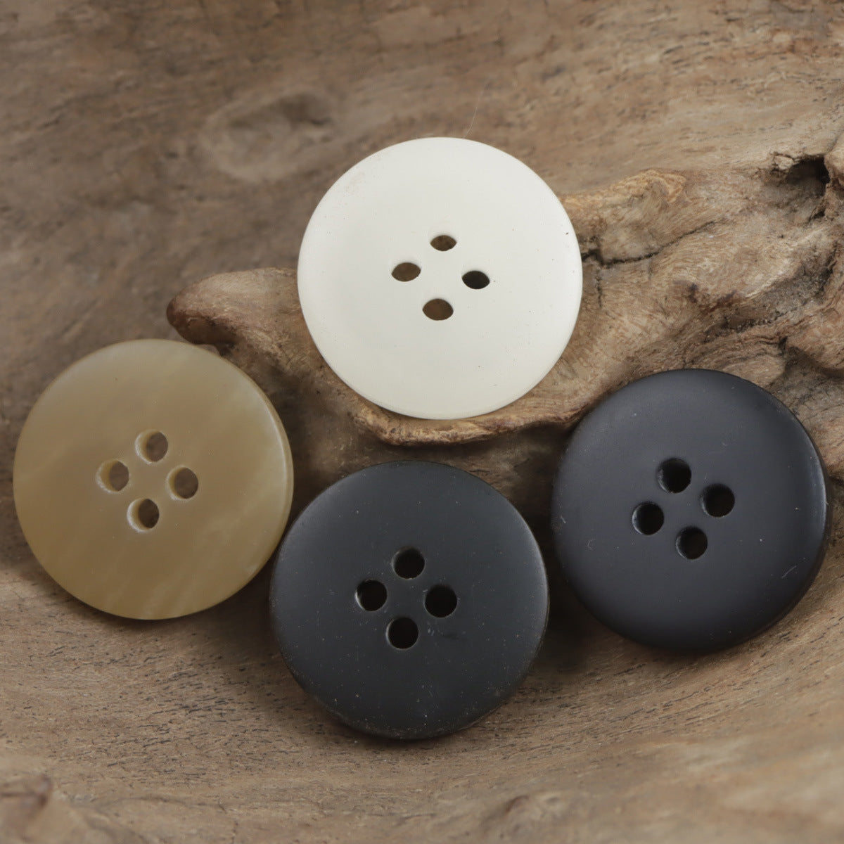 Assorted 4-hole resin buttons in cream, tan, and dark gray, round 15–25mm