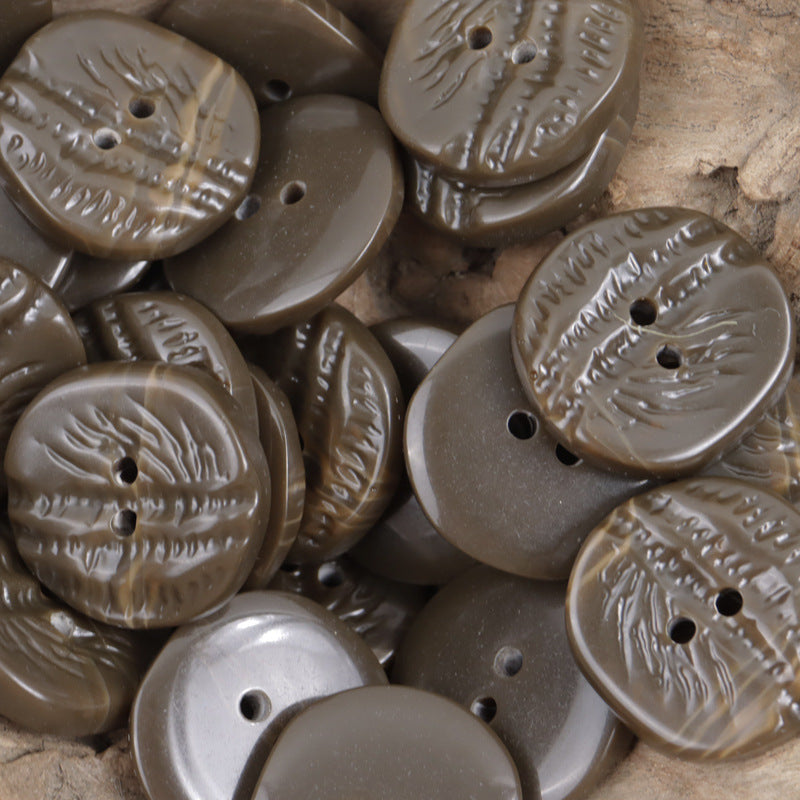 Coffee-brown resin coat buttons, palm-tree embossed texture, two-hole
