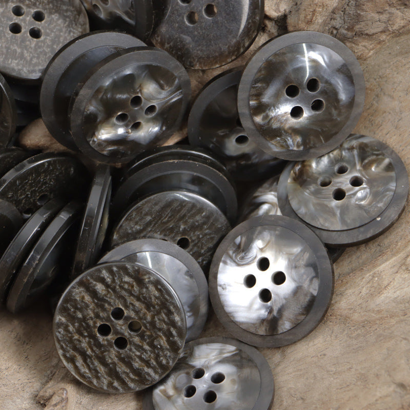 Round resin buttons in dark and silver-toned marbled finishes, 4 holes each