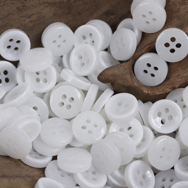 Round 4-hole resin buttons, white, bulk assortment in a pack