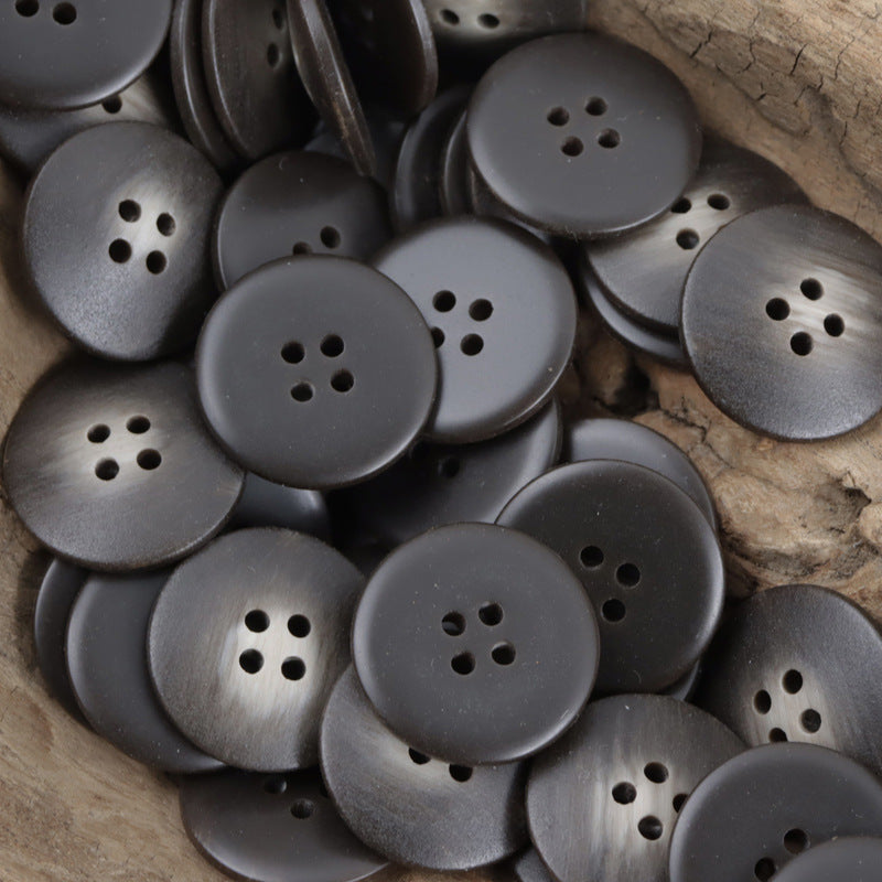Dark charcoal round resin buttons with 4-hole pattern, metallic matte finish