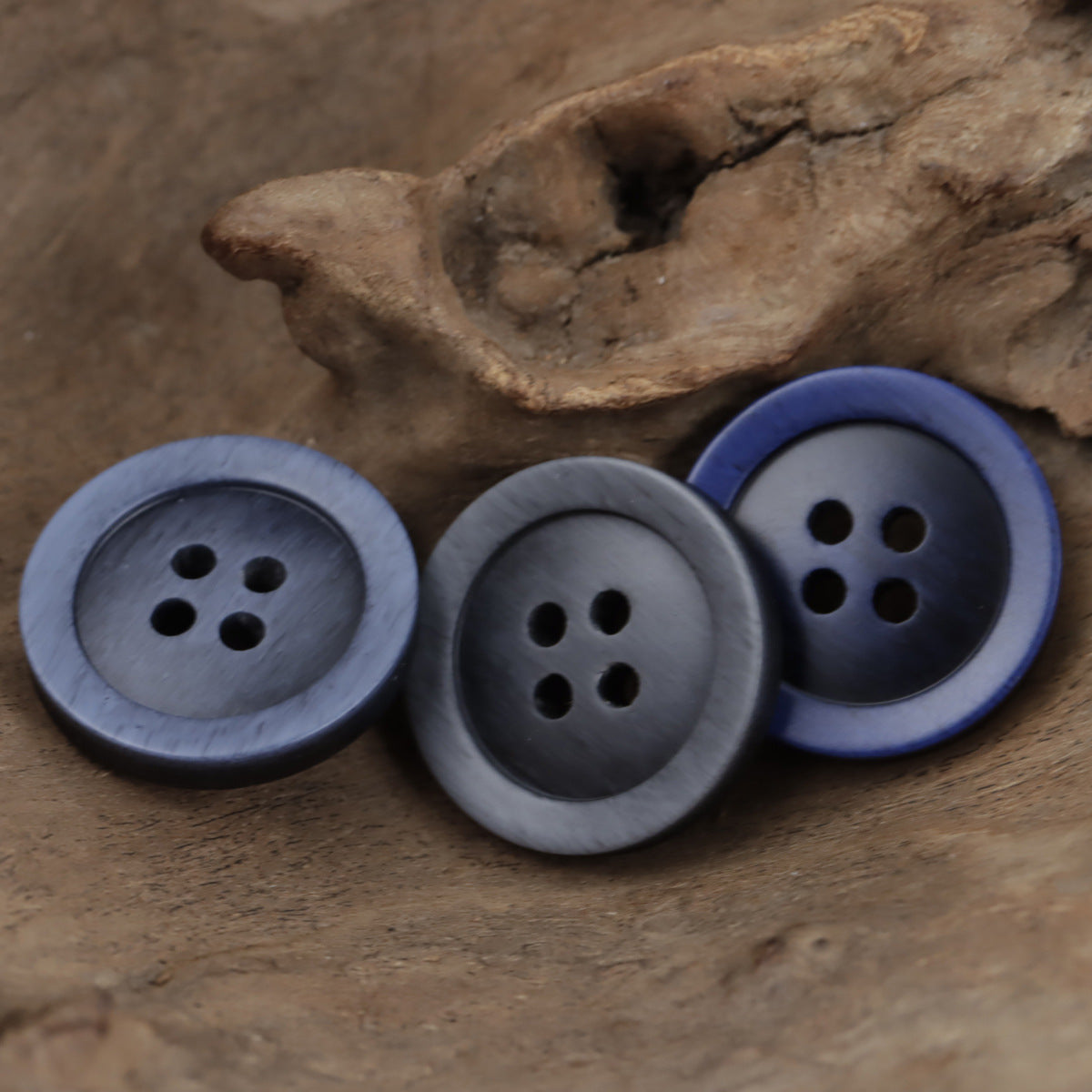 Resin buttons with 4 holes in gray-blue and dark blue imitation wood grain