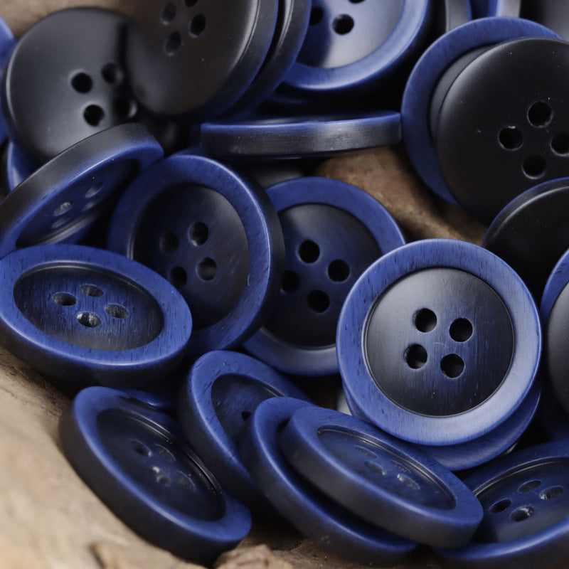 Multiple 4-hole resin buttons in dark blue tones with imitation wood grain rim
