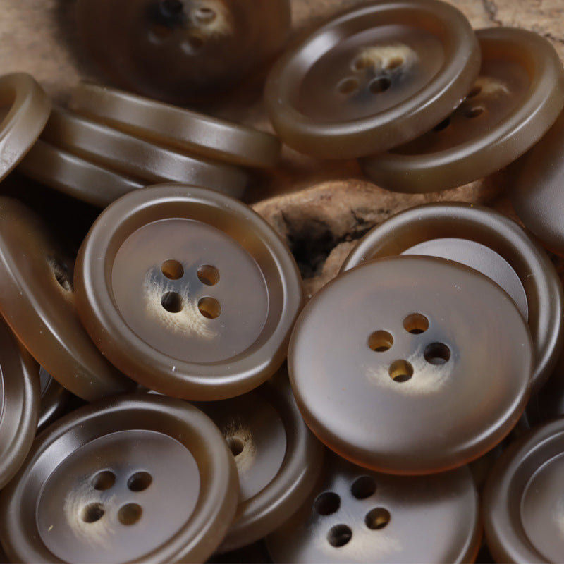 Coffee-brown resin 4-hole buttons, domed face close-up, assorted pieces