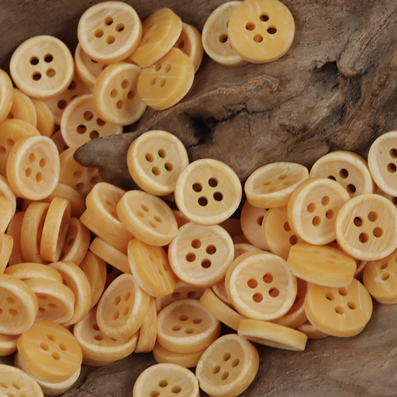 Lot of round resin-look yellow buttons with 4 holes