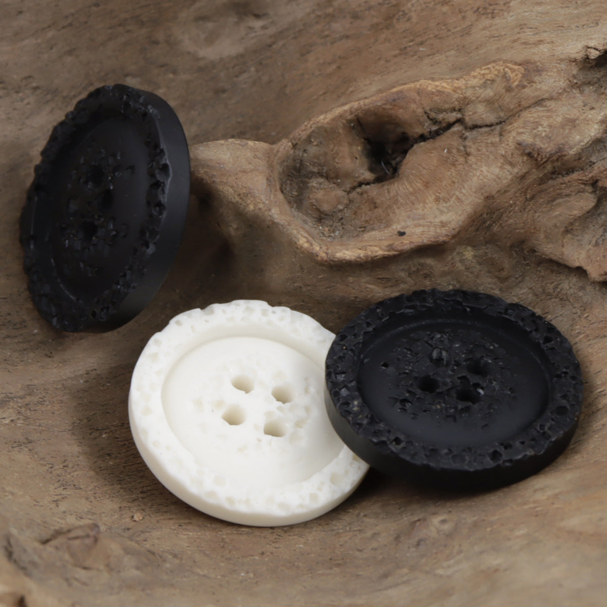 Textured resin buttons for sweatshirts, 4-hole white and black set (multiple buttons).