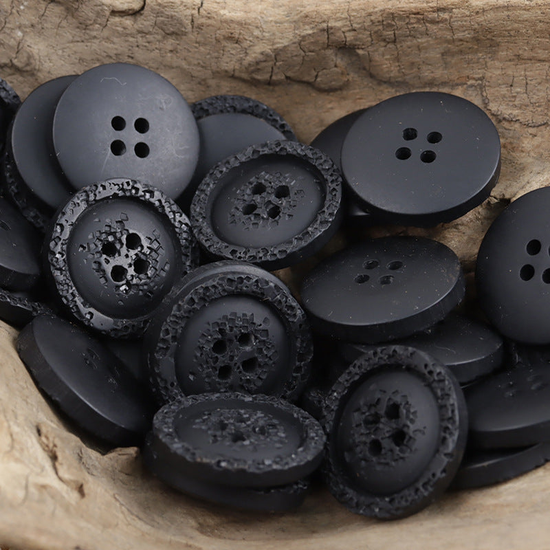 Black textured resin shirt buttons, round 4-hole style for sweatshirts (multiple pcs).