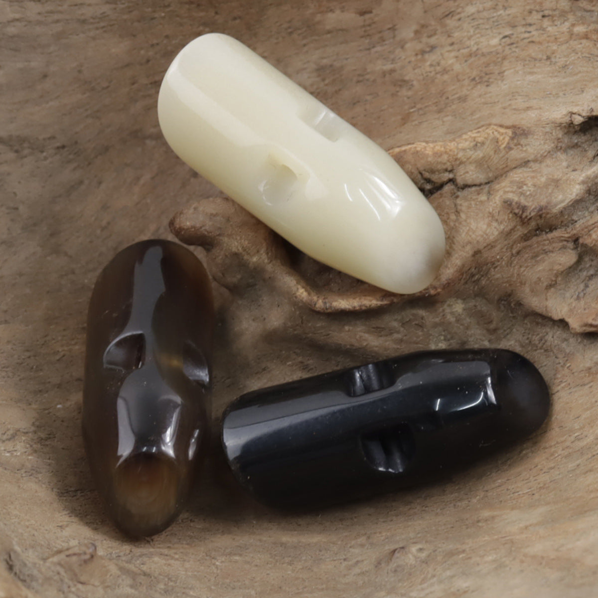 Beige irregular horn resin button, glossy teardrop shape with button hole