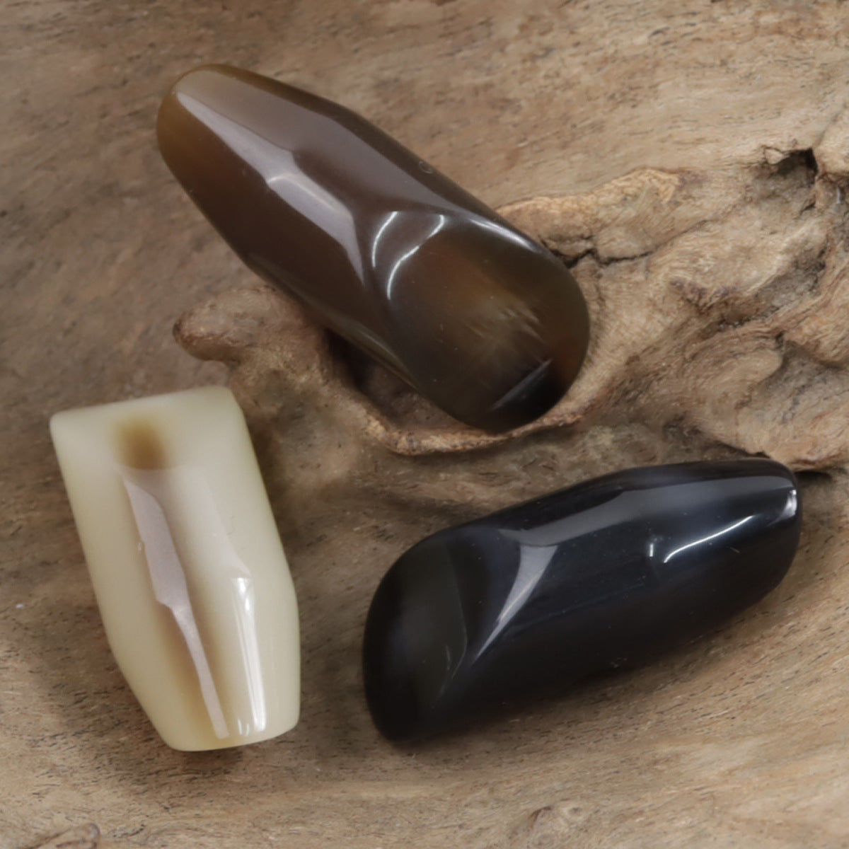 Coffee-colored irregular horn resin button, glossy teardrop shape with hole