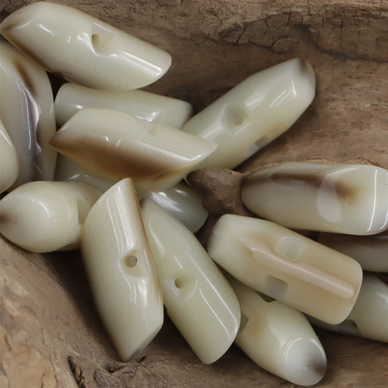 Beige irregular horn resin buttons set, glossy teardrop shapes with visible holes