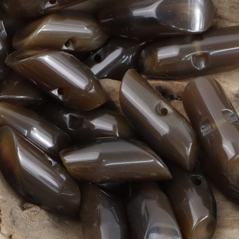 Brown irregular horn resin buttons set, glossy teardrop shapes with visible holes