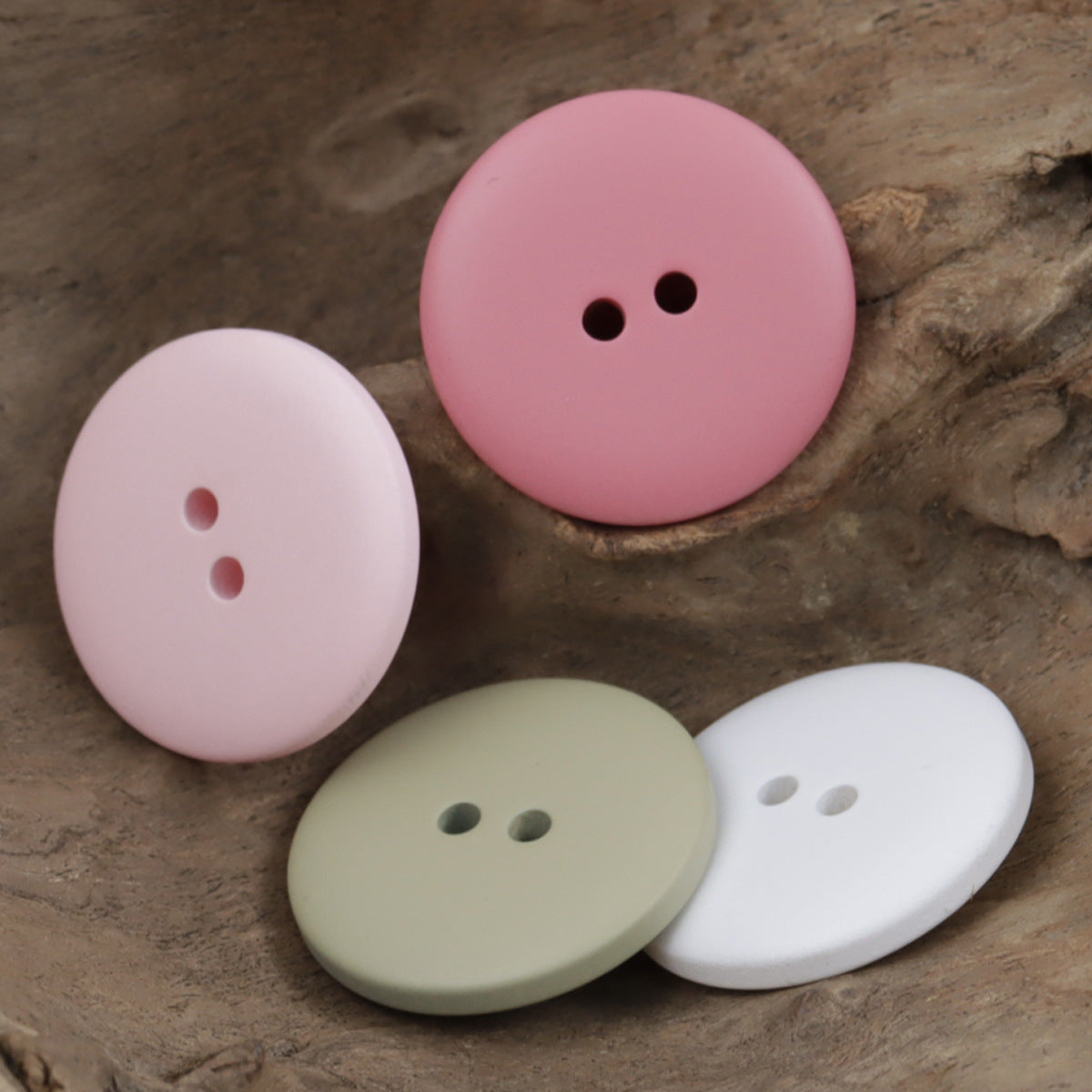 30mm matte fish-eye resin buttons: pink and white with two-hole shanks