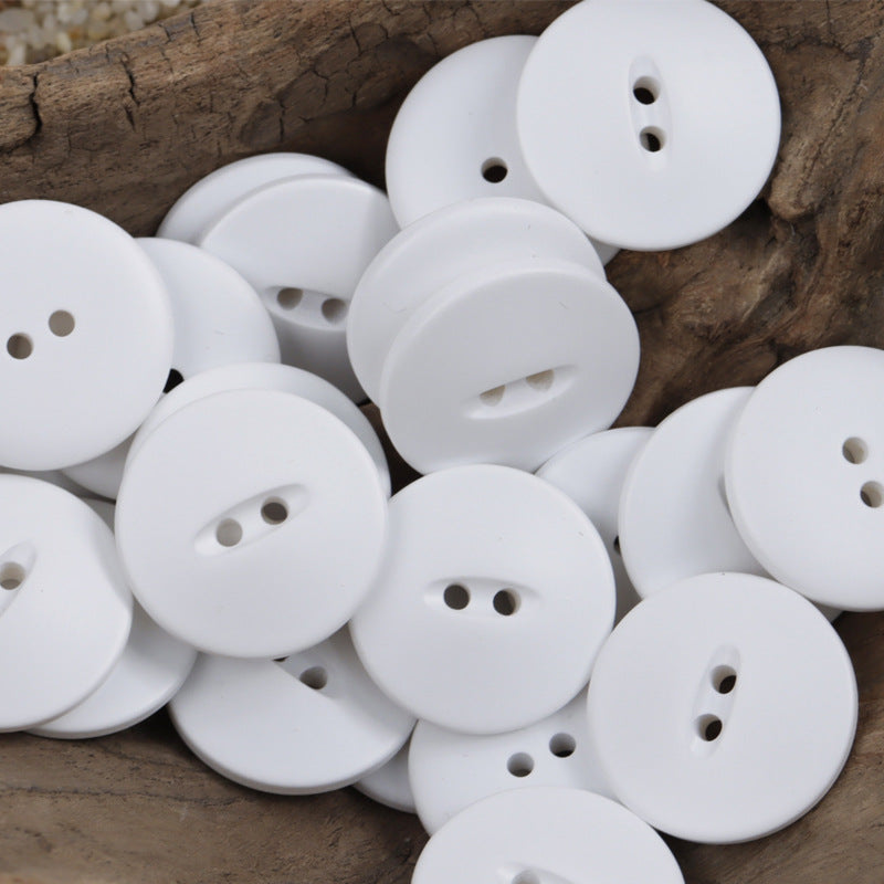 White 30mm matte fish-eye resin buttons with two- or three-hole shanks