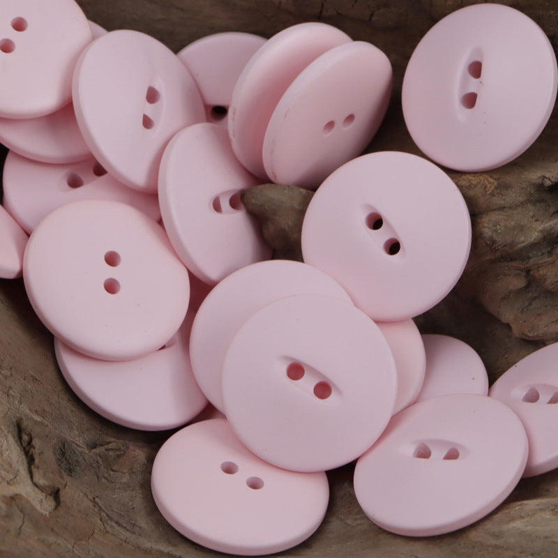 Light pink 30mm matte fish-eye resin buttons with two- or three-hole shanks