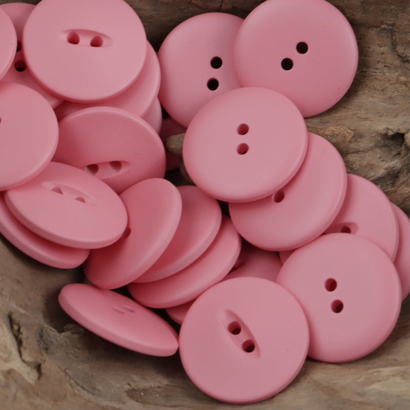 Pink 30mm matte fish-eye resin buttons with two-hole shanks, round matte finish