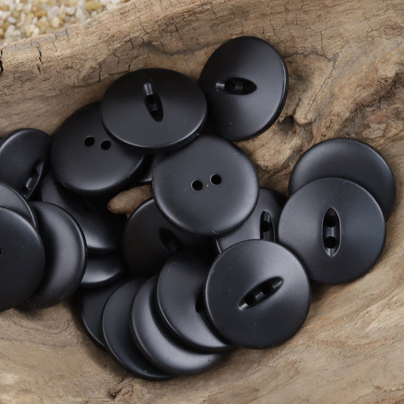 Black 30mm matte fish-eye resin buttons with two-hole shanks, round matte fronts
